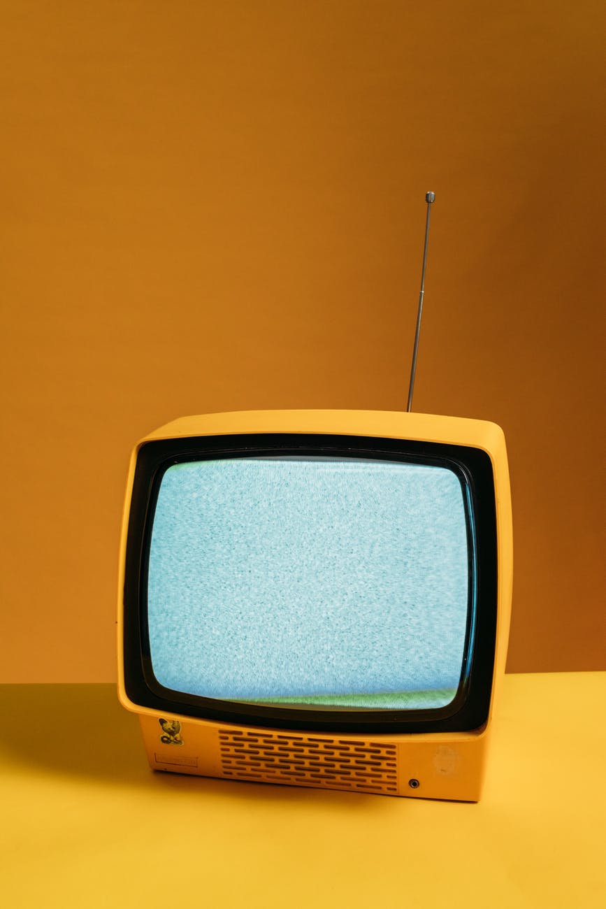 classic yellow tv with blank screen
